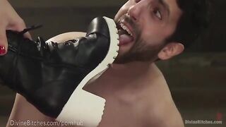 The muscled dominatrix beats and wrestles her slaveboy