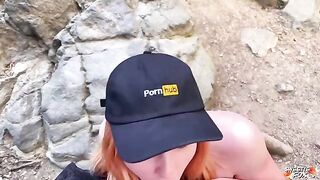 A girl is having fun with boy in the nature, risking to be noticed