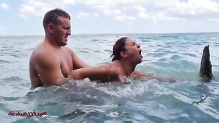 A hot girl is having sex in the blue lagoon, showcasing sensual outdoor passion