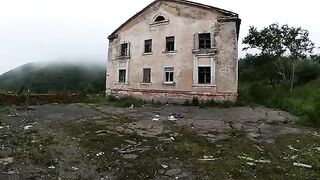 An exhibitionist girl is walking around horrible buildings with her sexy bbe