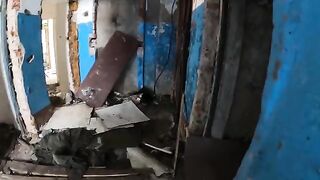 An exhibitionist girl is walking around horrible buildings with her sexy bbe