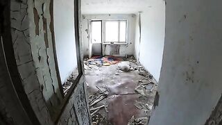 An exhibitionist girl is walking around horrible buildings with her sexy bbe