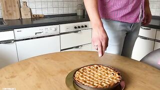 Two sexy women having fun with a young man in the kitchen