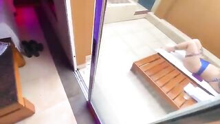 A redhead woman has sex in a bikini with an employee in a public place