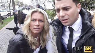 The collector has sex with the blonde in front of her husband