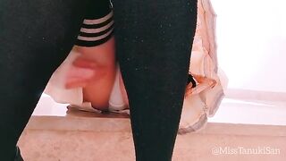 A cute schoolgirl masturbates without panties, showcasing her erotic charm in a solo performance