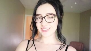 The girl is reading a funny book and she doesn't want to cum