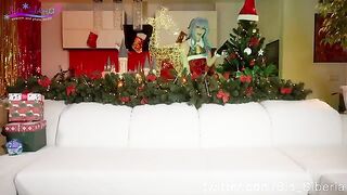 Sia Siberia in Christmas cosplay, playing with a toy in a sensual way