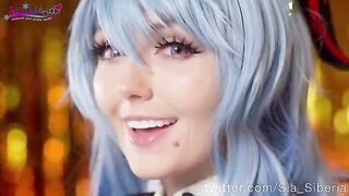 Sia Siberia in Christmas cosplay, playing with a toy in a sensual way