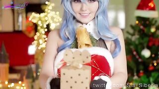 Sia Siberia in Christmas cosplay, playing with a toy in a sensual way