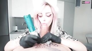 A girl is getting a tattoo at home and the guy shoots his cum on her