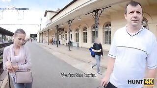 A cute girl is meeting a guy on the train station to earn some money