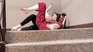 The stepsister is teasing her stepbrother, leading to hot sex on the stairs