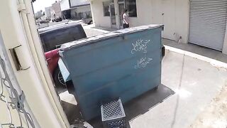 A couple got intimate behind the garbage tank, unnoticed