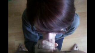 The girl sank to the ground and began to work with her mouth