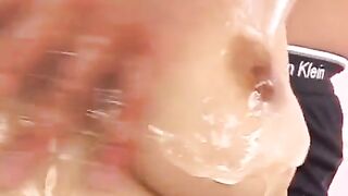 Oiled Japanese boobs captured in a sensual fingering member pose