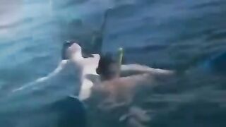 Underwater sex of two aqualangists at the bottom of the sea