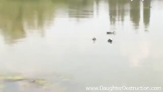 A girl is trying to attract a guy on the pier