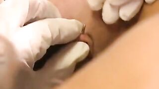 A girl with a big clitoris plays with a sex toy