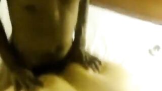 A fat woman with a big body lay down on a man's dick