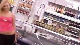 A blond thief tries to take cash from the cashier by her ass