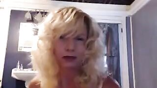 A woman aged herself in the bathroom with pleasure