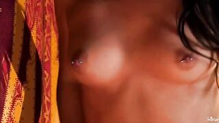 A girl with a nipple piercing plays with her fingers in her pussy