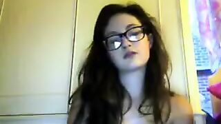A student with glasses gets undressed on a webcam