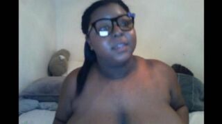 The black woman closed the camera with her big natural tits during the milking session