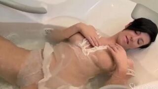 Brunette woman masturbating alone in the shower