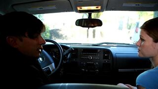 A girl has fun with the guy in his car, making a blowjob