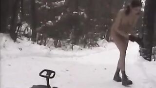 Naked beauties play snowballs in the winter on the city streets
