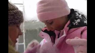 Two girls are having fun in the cold of winter