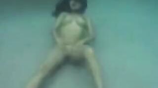 Underwater sex with busty brunette beauty in ocean