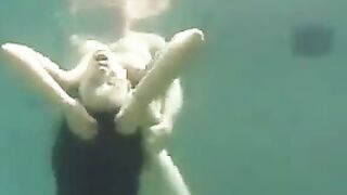 Underwater sex with busty brunette beauty in ocean