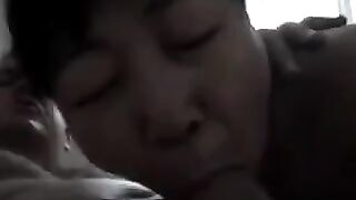 The Chinese girl practices blowjob with her man