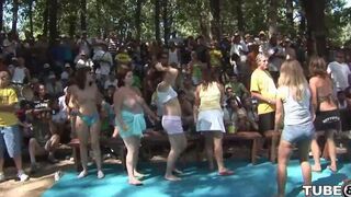 Two young people have fun and engage in intimate activities in the forest