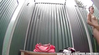 A girl takes a shower and suddenly a camera appears out of nowhere
