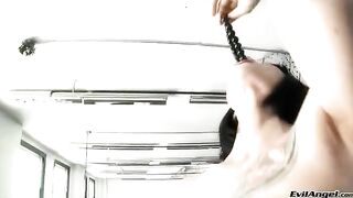 She plays with a ball and rubs it in her pussy with high heels