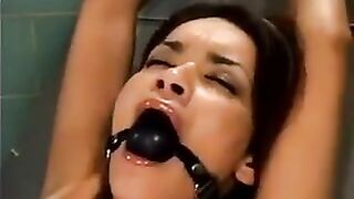 A bald guy forced sex on a girl using a sex machine