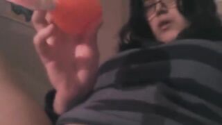 A girl caresses her clitoris using a vibrator to achieve orgasm