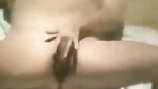 A girl masturbates on the beach with a hidden camera capturing it all