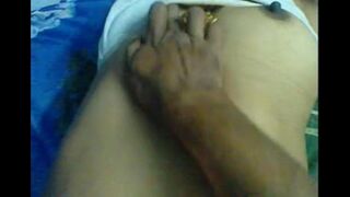 The husband makes a massage of the nipples for his wife