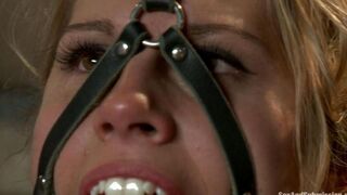 A woman in bondage is being roughly treated by her dominant mistress
