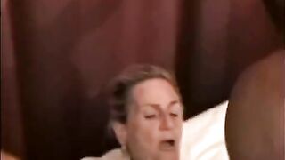A black guy is fucking a woman with big tits