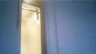 A wife is running around the apartment in a thong while the troops are watching