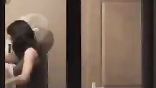 The guy admires himself in the mirror, standing in front of him completely naked