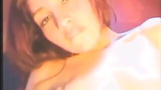 A beauty plays with a vibrator in all holes, from front to back