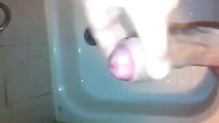The kid masturbates his dick in the shower