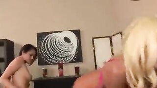 Lesbians in skirts fuck each other with dildo and vibrator on the bed